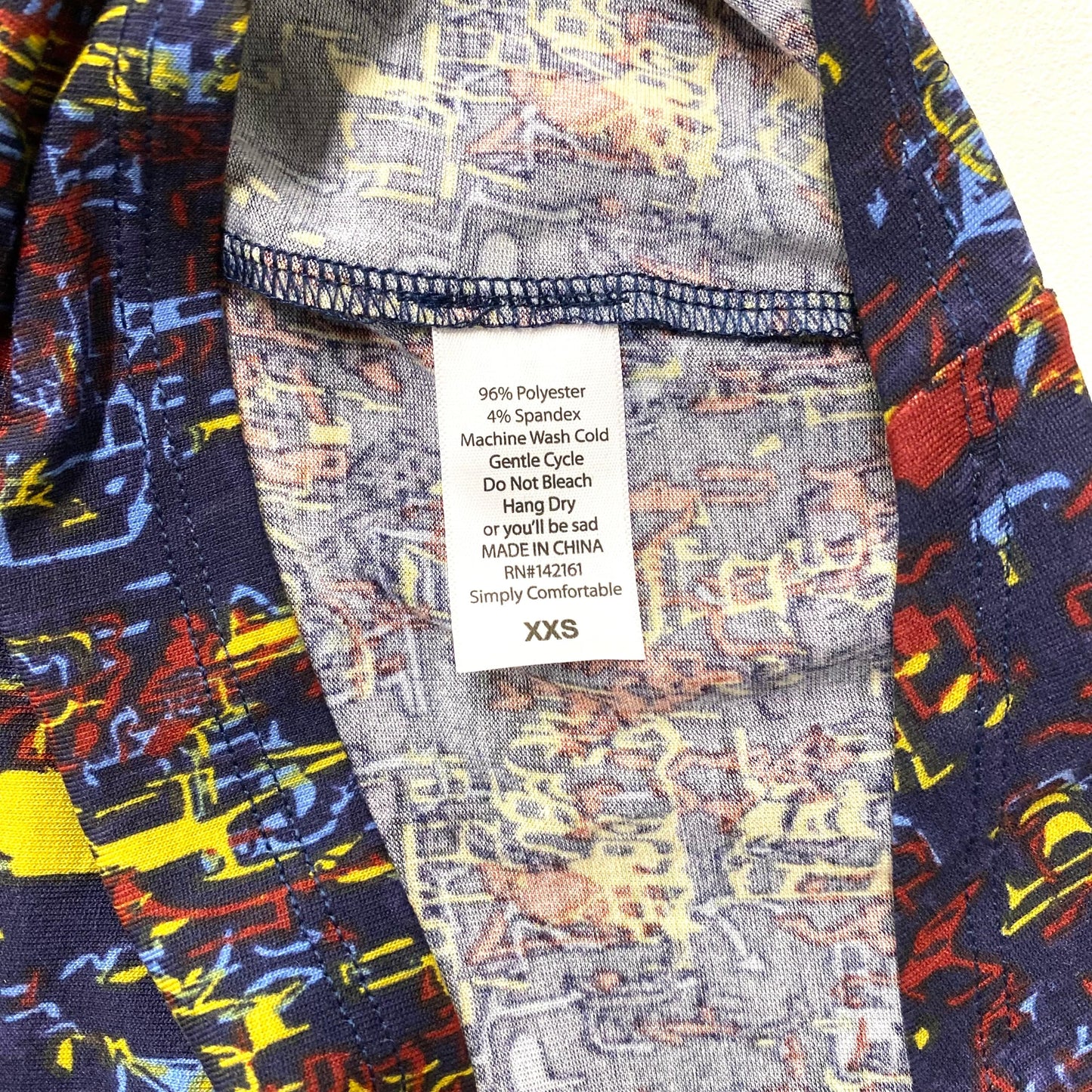 LuLaRoe Womens XXS Irma Red/Yellow/Blue Abstract S/s Tunic Top NWT