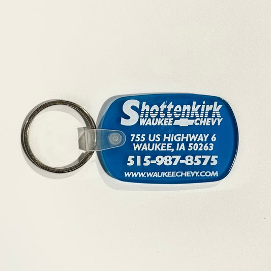 ‘Shottenkirk Waukee (IA) Chevy’ Keychain Key Ring Blue Rubber Oval