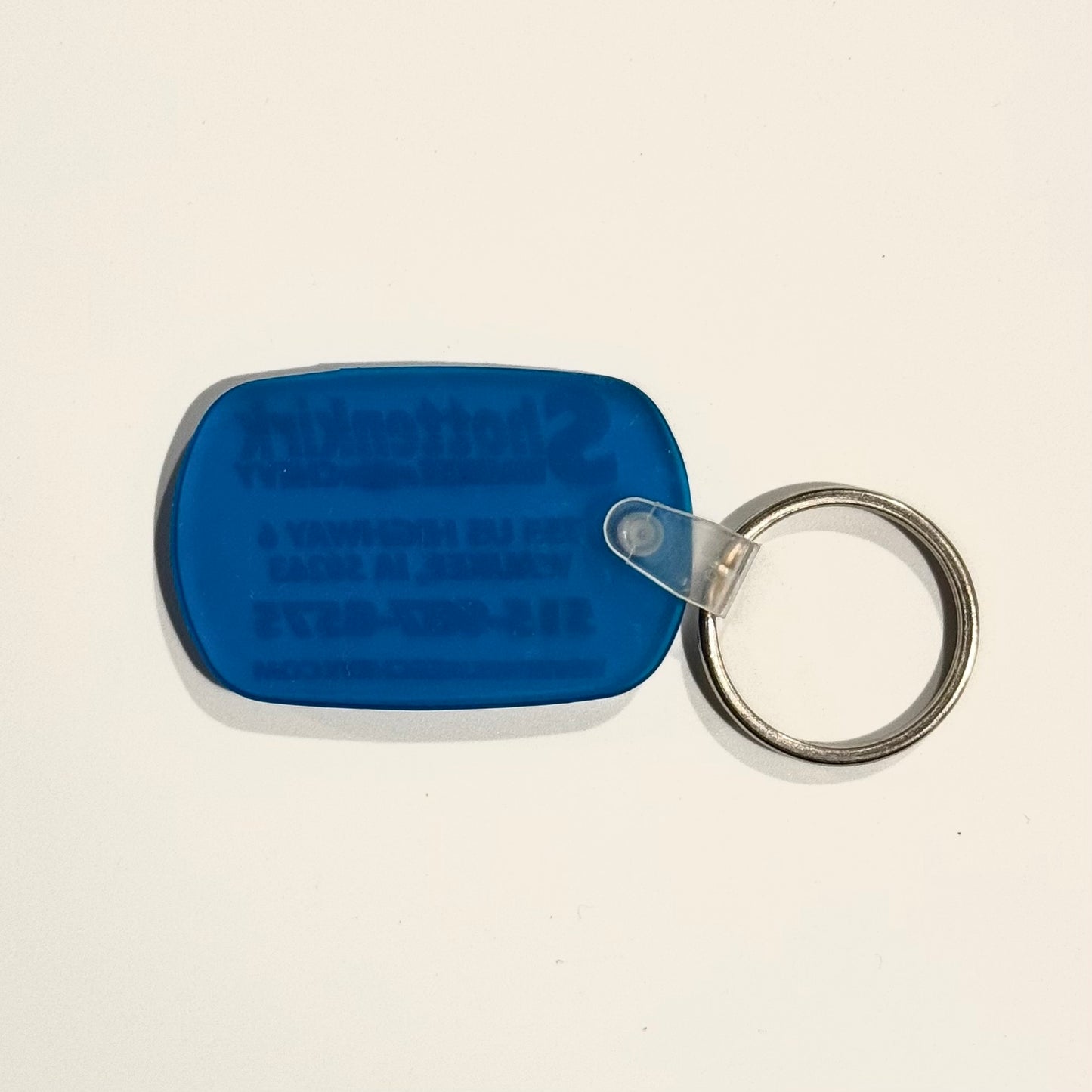 ‘Shottenkirk Waukee (IA) Chevy’ Keychain Key Ring Blue Rubber Oval