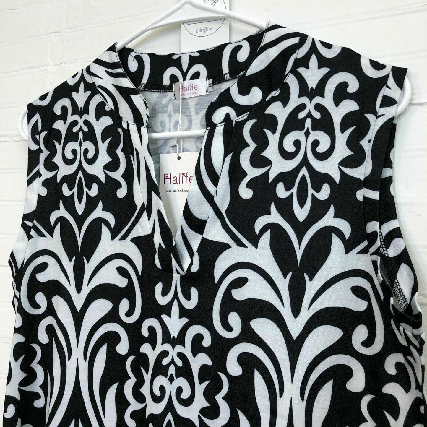 Elegant Halife Womens Floral V Neck Sleeveless Shirt - Size M, White/Black - | Buy at Parsimony Shoppes