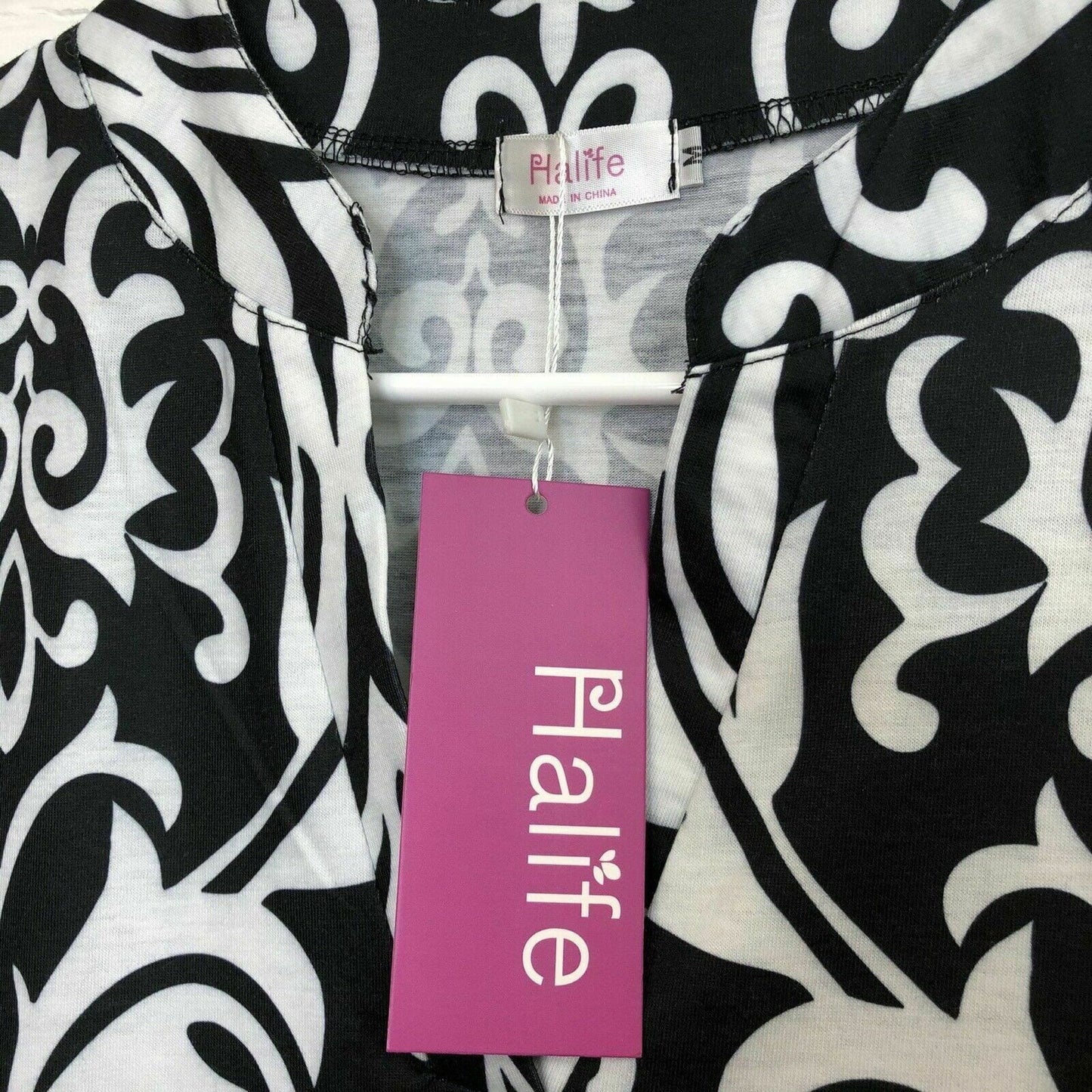 Elegant Halife Womens Floral V Neck Sleeveless Shirt - Size M, White/Black - | Buy at Parsimony Shoppes