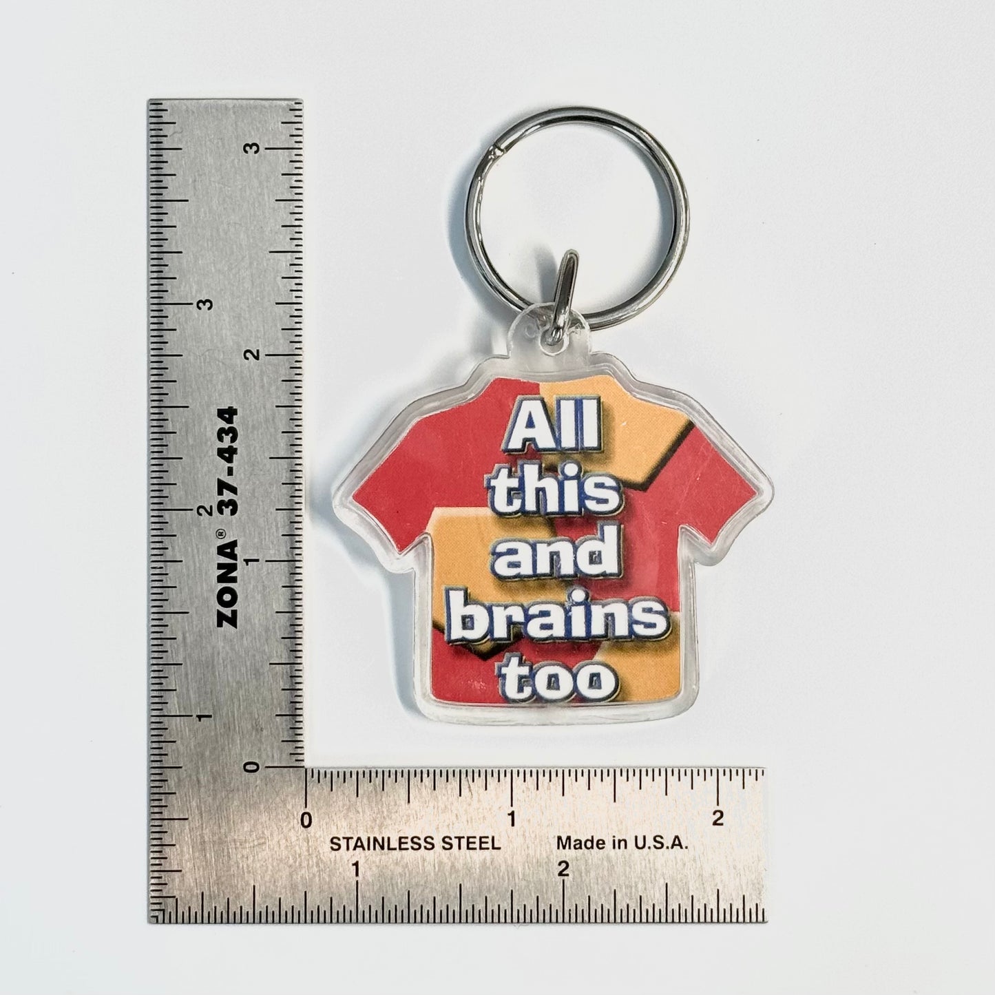 Novelty T-Shirt Acrylic Keychain ‘All this and brains too’ Key Ring, Pre-Owned