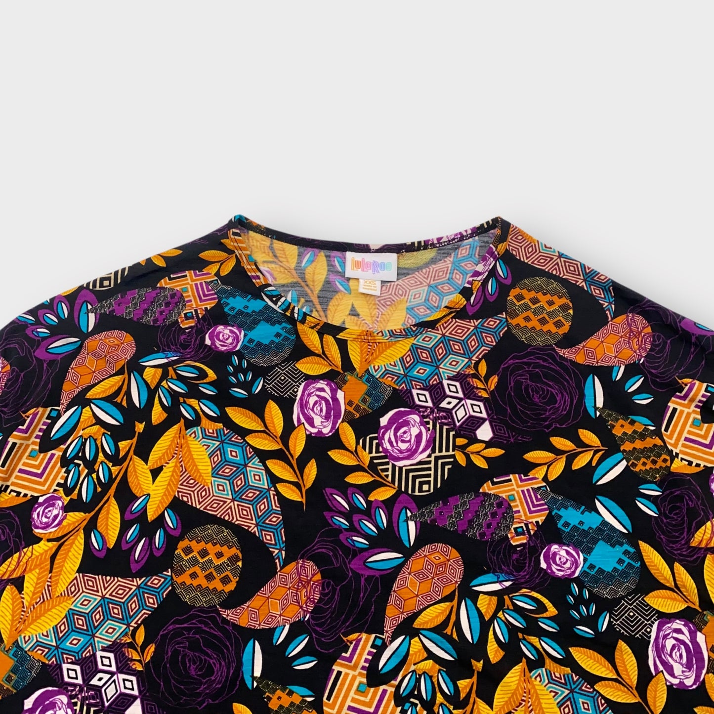 LuLaRoe Irma Tunic Top - Black with Purple, Yellow & Blue Geometric Floral Print - XXS (00) - Soft Stretch Polyester Spandex - High-Low Hem