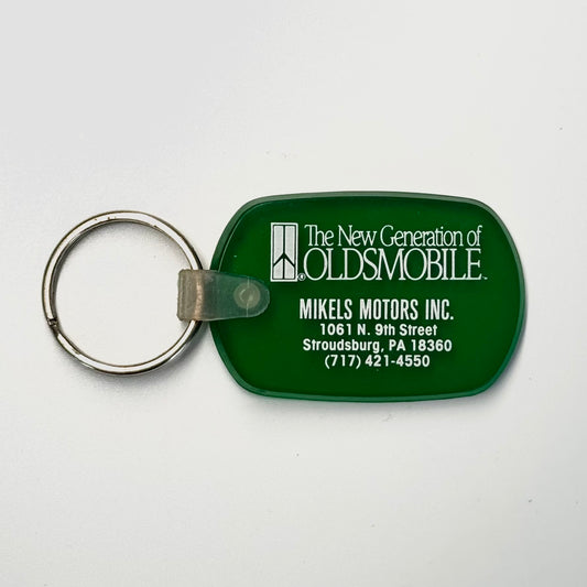 Vintage ‘Mikels Motors Oldsmobile -Stroudsburg, PA’ Keychain Key Ring Green Rubber Ov