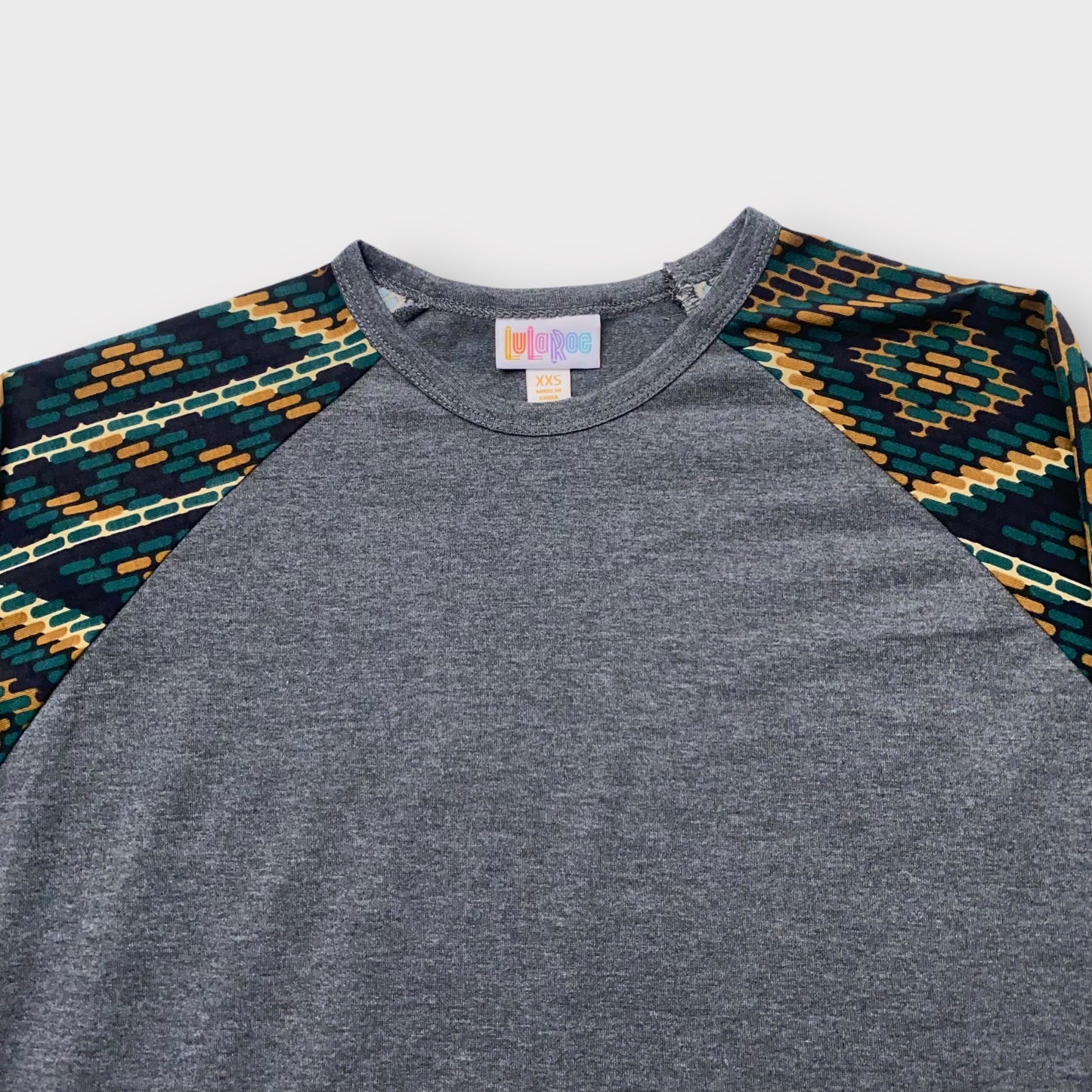 LuLaRoe Randy Raglan Tee XXS (00) - Charcoal Gray with Green/Gold/Black Aztec Geometric Sleeves - Soft Stretch Fabric