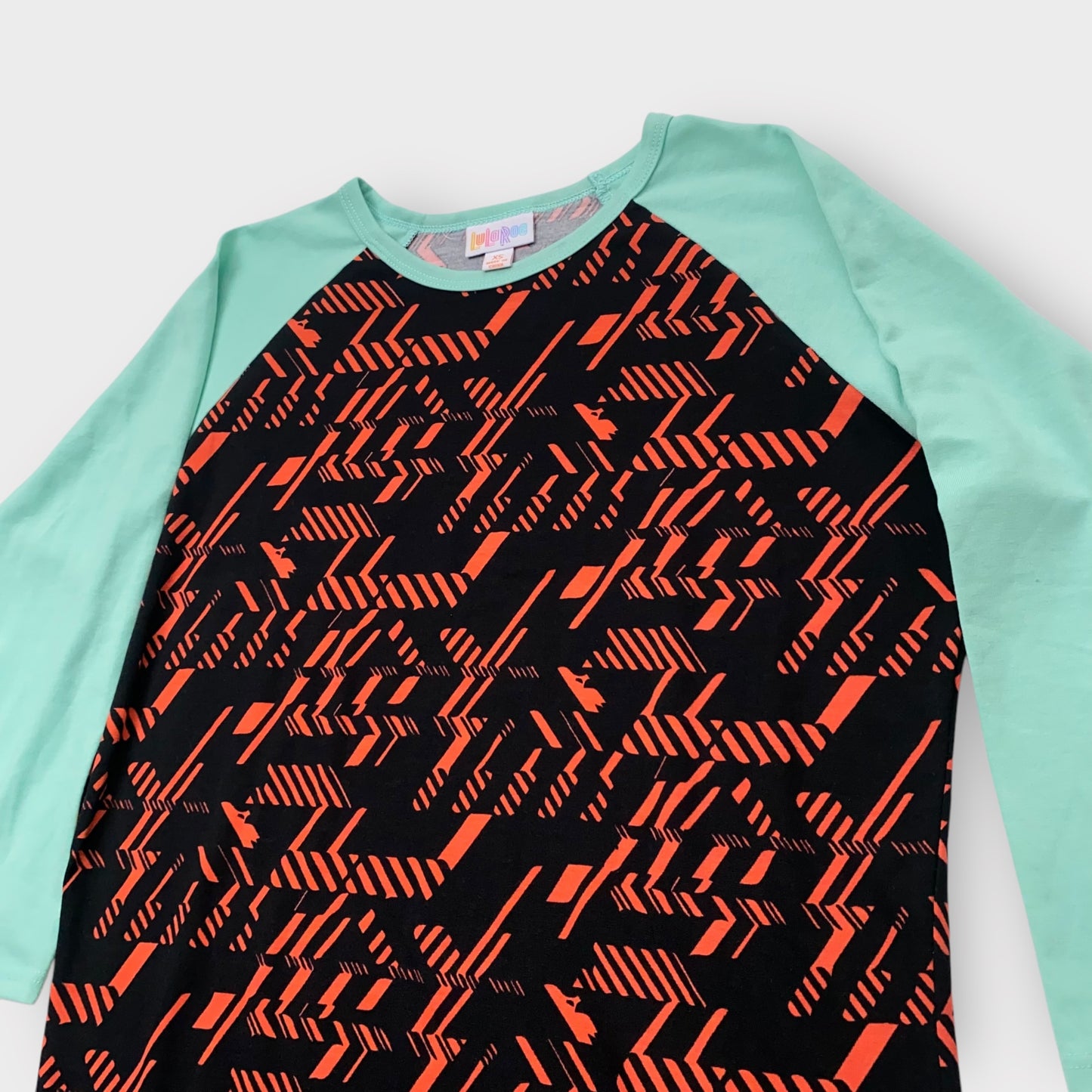 LuLaRoe Randy Raglan Tee XS (0-2) - Black/Red Geometric Abstract Print with Mint Green Sleeves - Soft Stretch Fabric