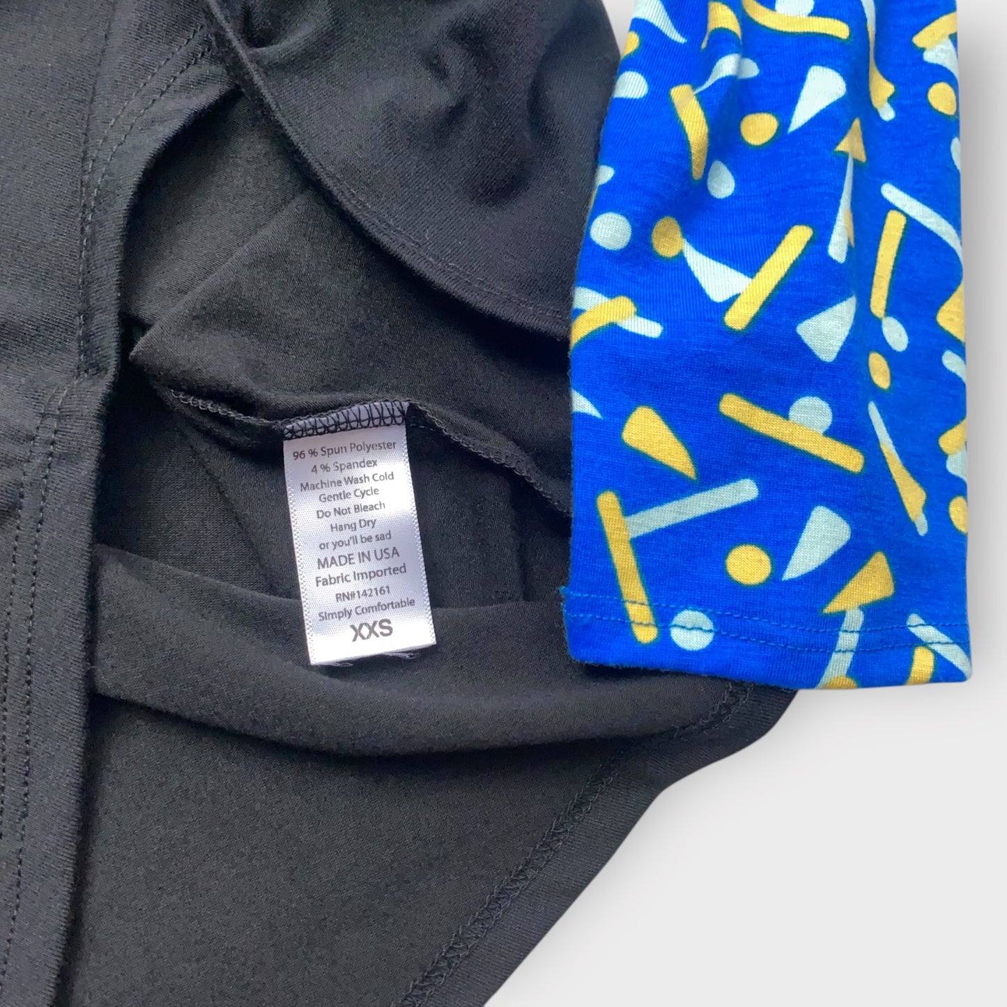 LuLaRoe Randy Tee XXS (00) - Black with Blue & Yellow Abstract Print Sleeves - Soft Stretch Fabric