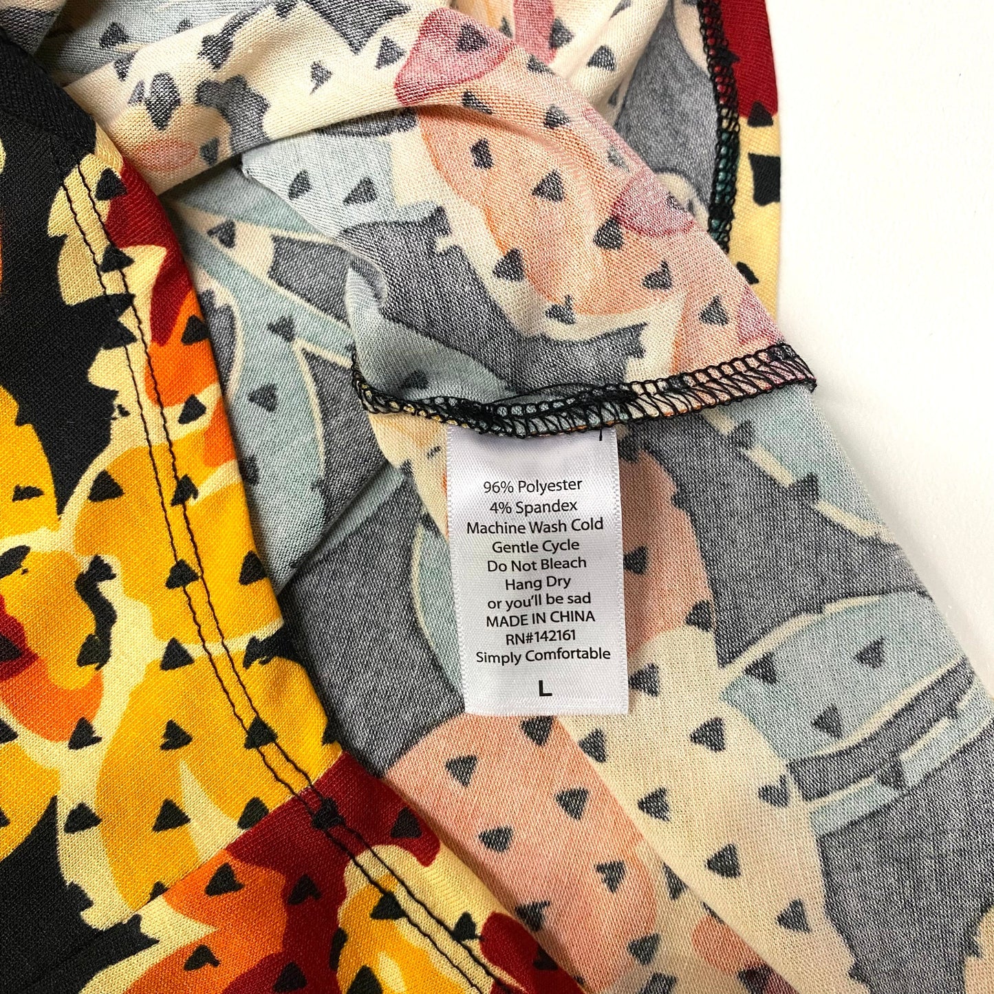 LuLaRoe Womens L Black/Orange/Gray Floral/Triangles Randy Raglan Top ¾ Sleeves NWT