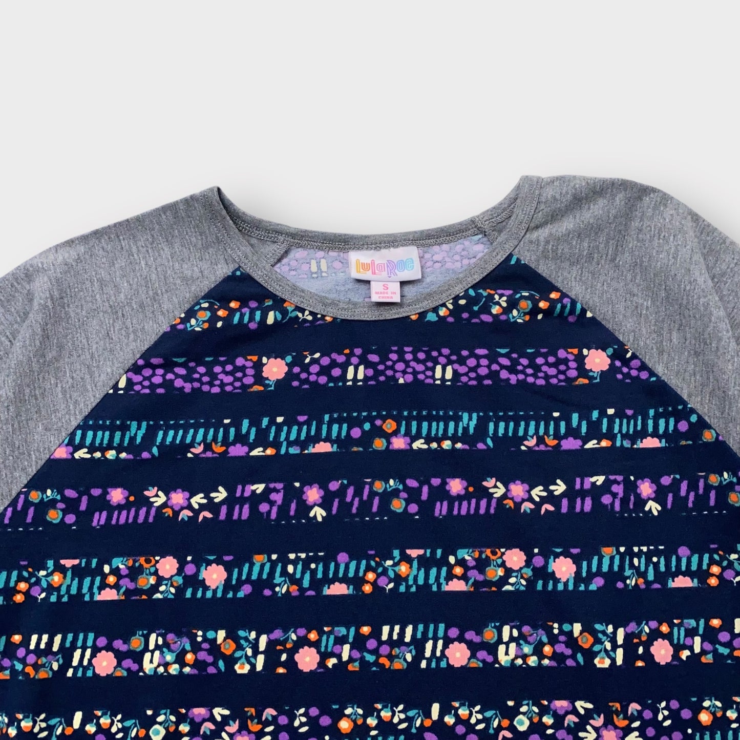 LuLaRoe Randy Tee S (4-6) - Navy and Multicolor Floral Striped Print with Gray Raglan Sleeves - Soft Stretch Polyester Spandex