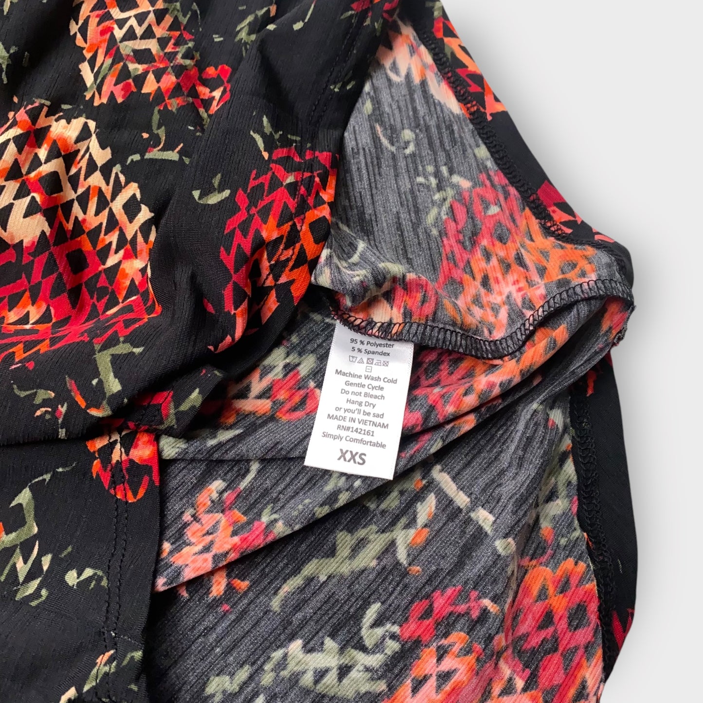 LuLaRoe Irma Tunic Top - Black with Red & Orange Geometric Floral Print - XXS (00) - Soft Stretch Polyester Spandex - High-Low Hem