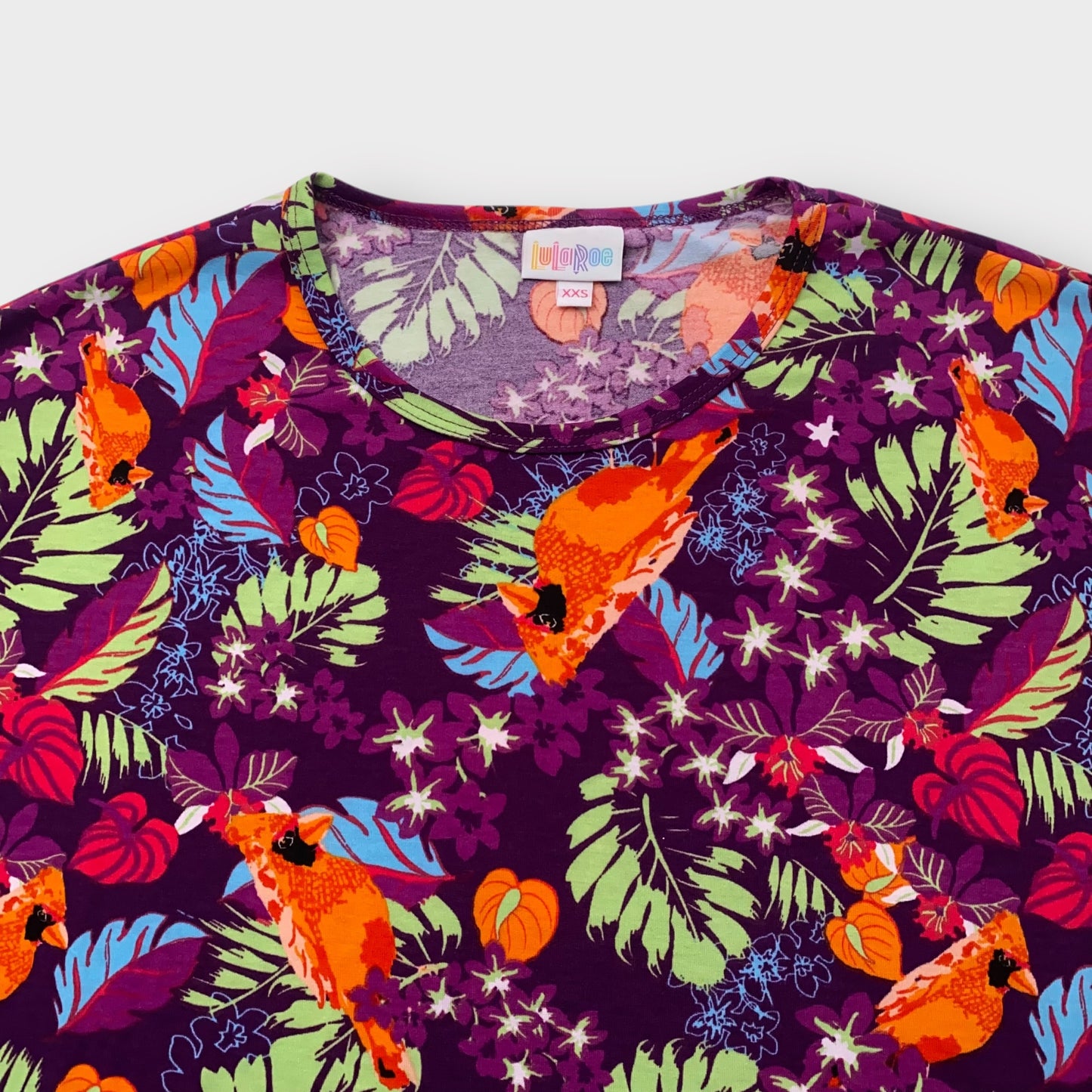 LuLaRoe Irma Tunic Top - Purple with Tropical Leaves & Orange Cardinal Bird Print - XXS (00) - Soft Stretch Polyester Spandex - High-Low Hem