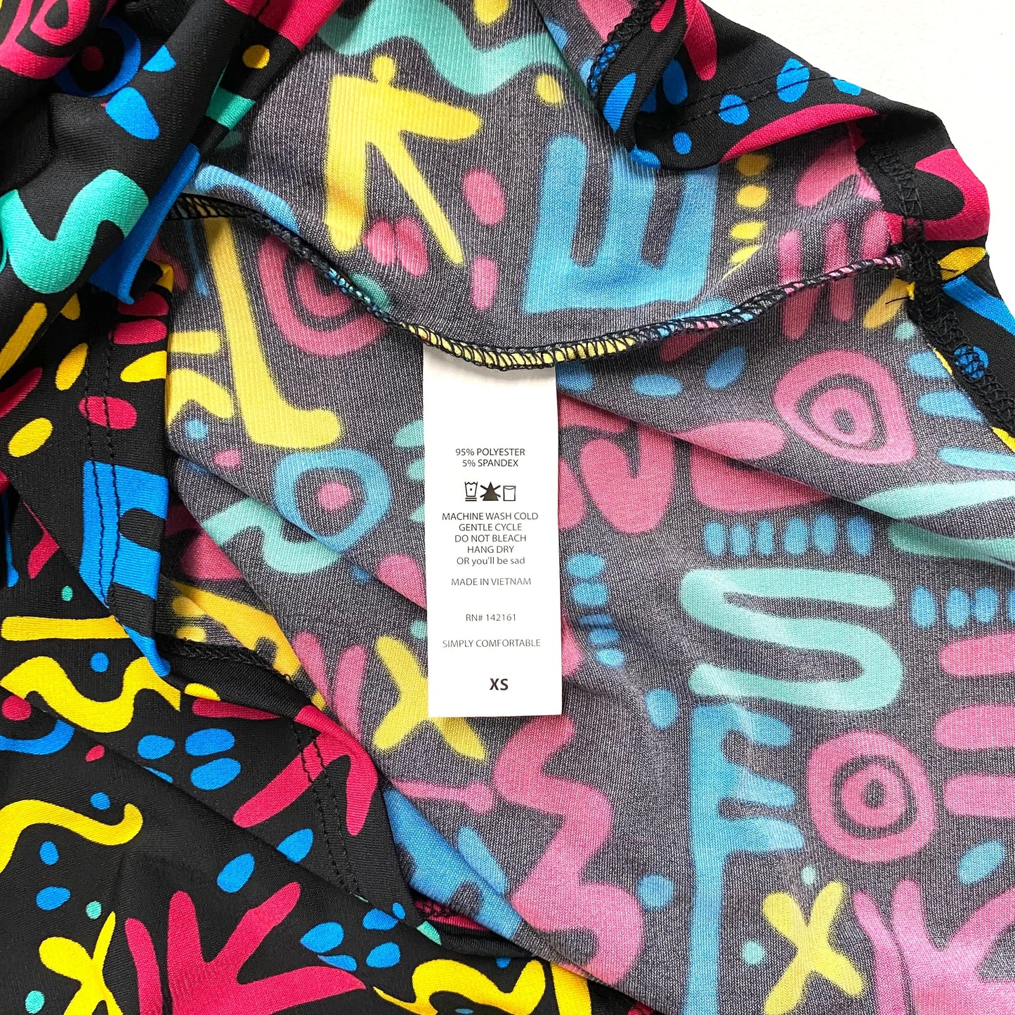 LuLaRoe Womens XS Irma Multicolor/Black Graffiti Pattern S/s Tunic Top NWT