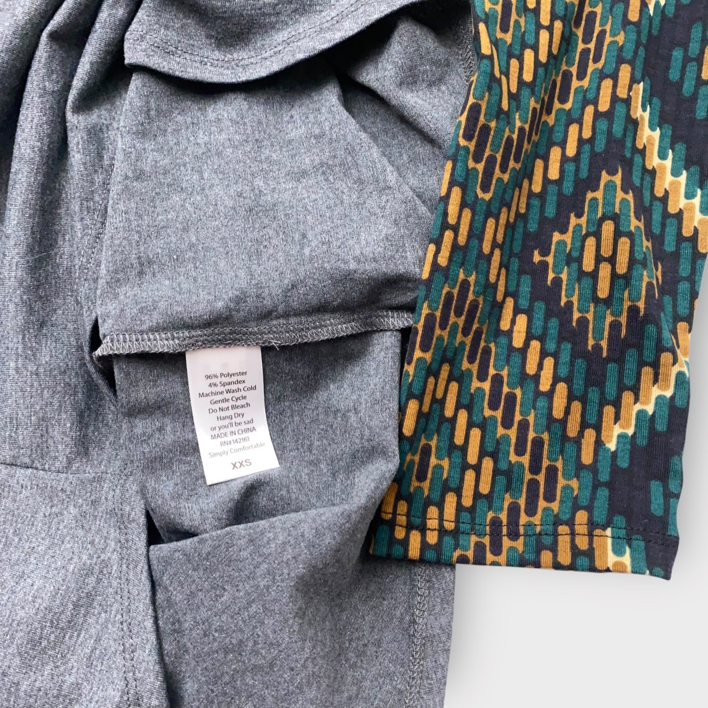 LuLaRoe Randy Raglan Tee XXS (00) - Charcoal Gray with Green/Gold/Black Aztec Geometric Sleeves - Soft Stretch Fabric